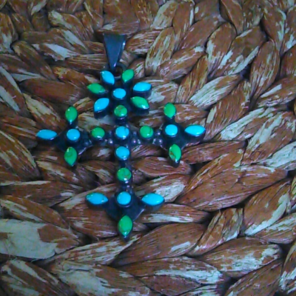 A large turquoise cross